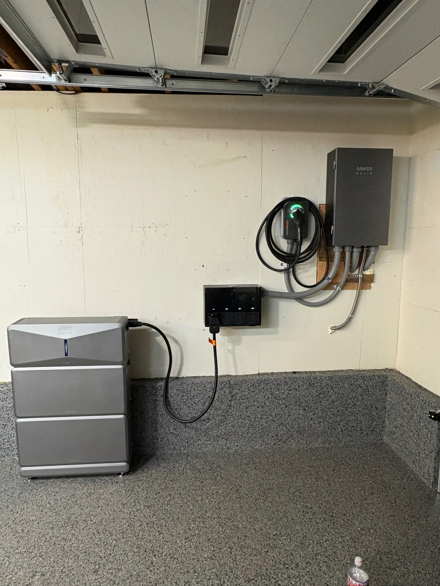 Garage install with Anker SOLIX battery stack, inverter and EV charger on a dedicated circuit