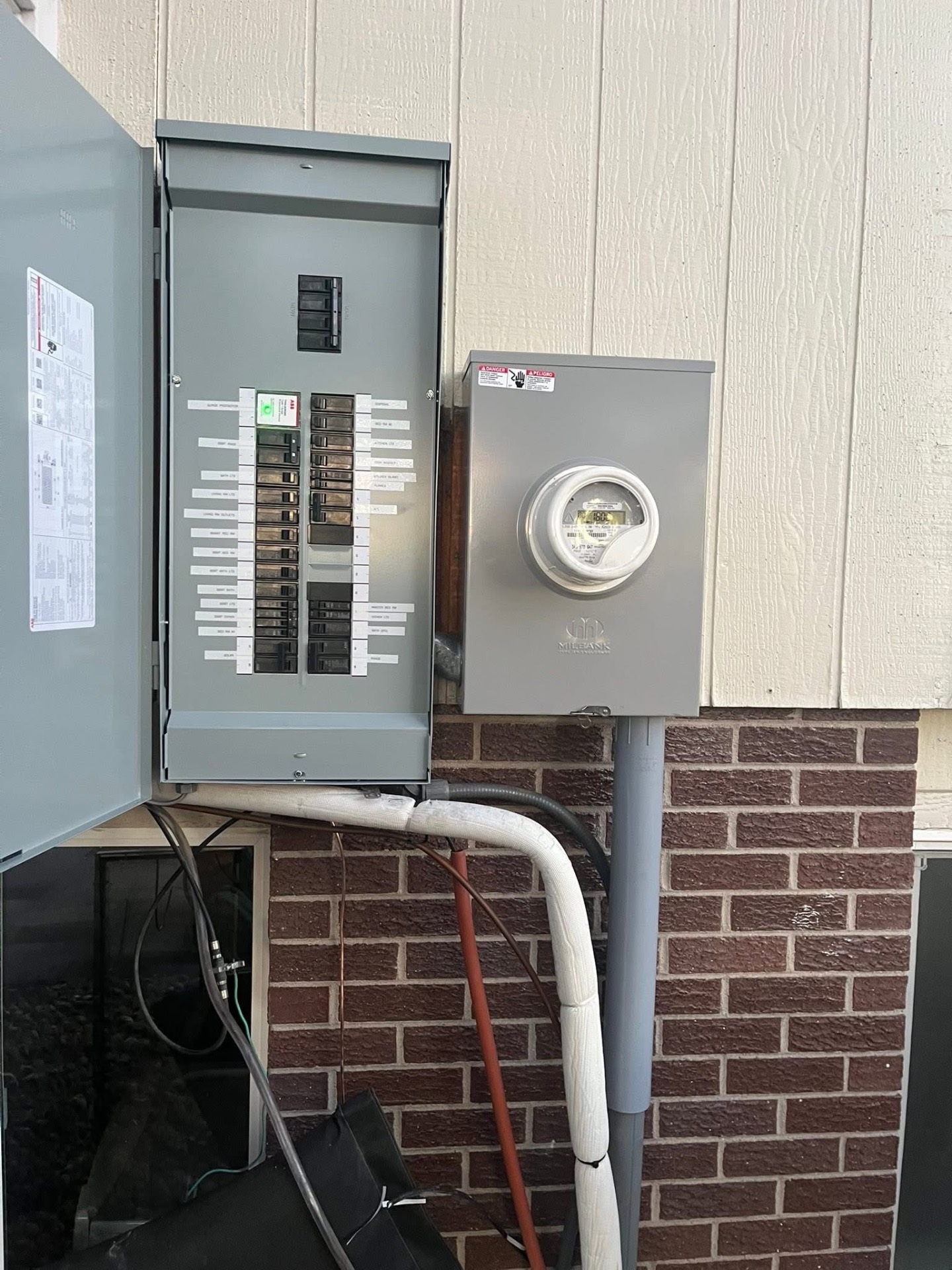 After: new 200 amp panel, labeled breakers, surge protection and new meter main
